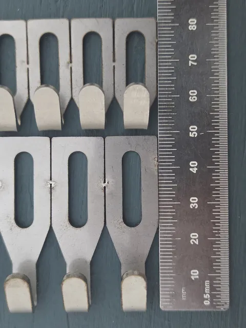 Centre Hook Stubby (top) and Small (bottom) beside a steel rule