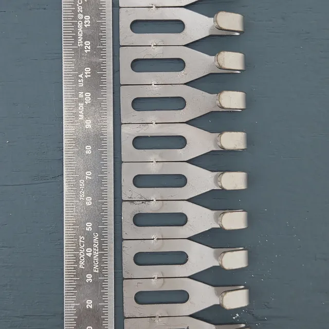 Centre Hook Small (50mm) hooks lined up beside a steel rule