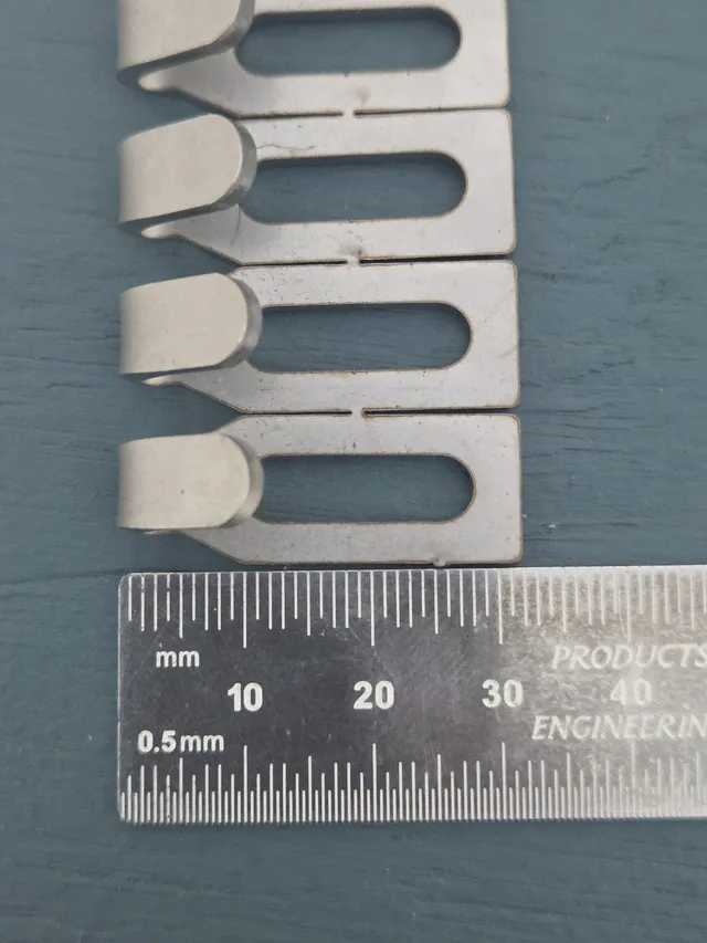 Centre Hook Stubby (32mm) stainless steel hooks above a steel rule marked in millimetres